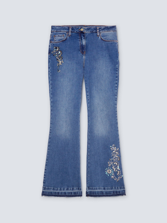 Jean flare turquoise avec riche broderie