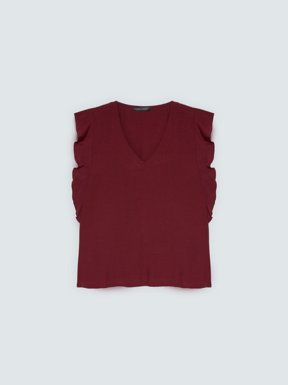 Muslin top with ruffles on the shoulders