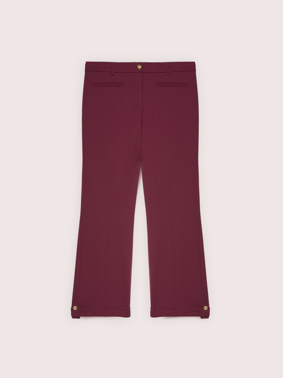 Cropped trousers with turn-up and button