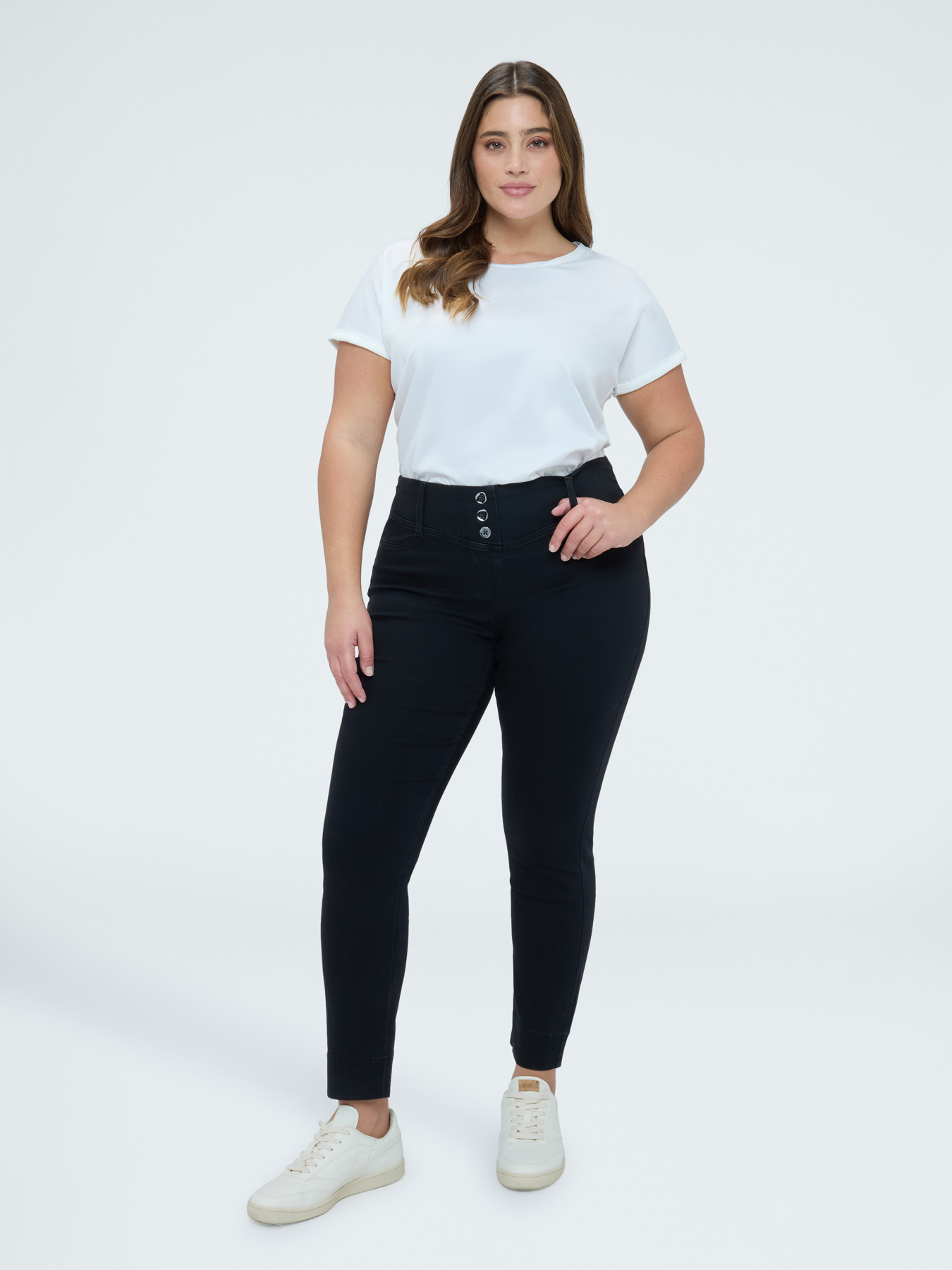 Black denim jeggings with decorative buttons image number 0