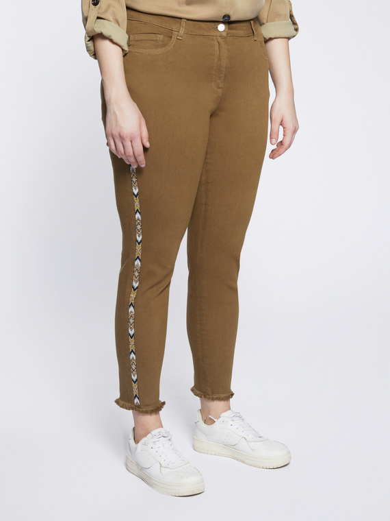 Skinny trousers with side appliqués