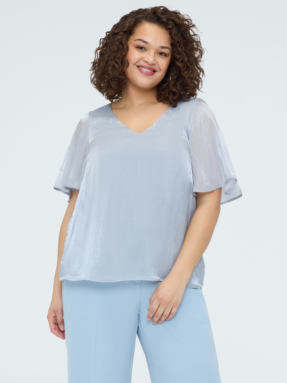 Bluse mit metallisierter Textur und Lichtpunkten