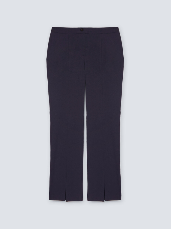Trousers with slits at the hem