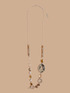 Collana lunga con perline e medaglione maculato image number 0