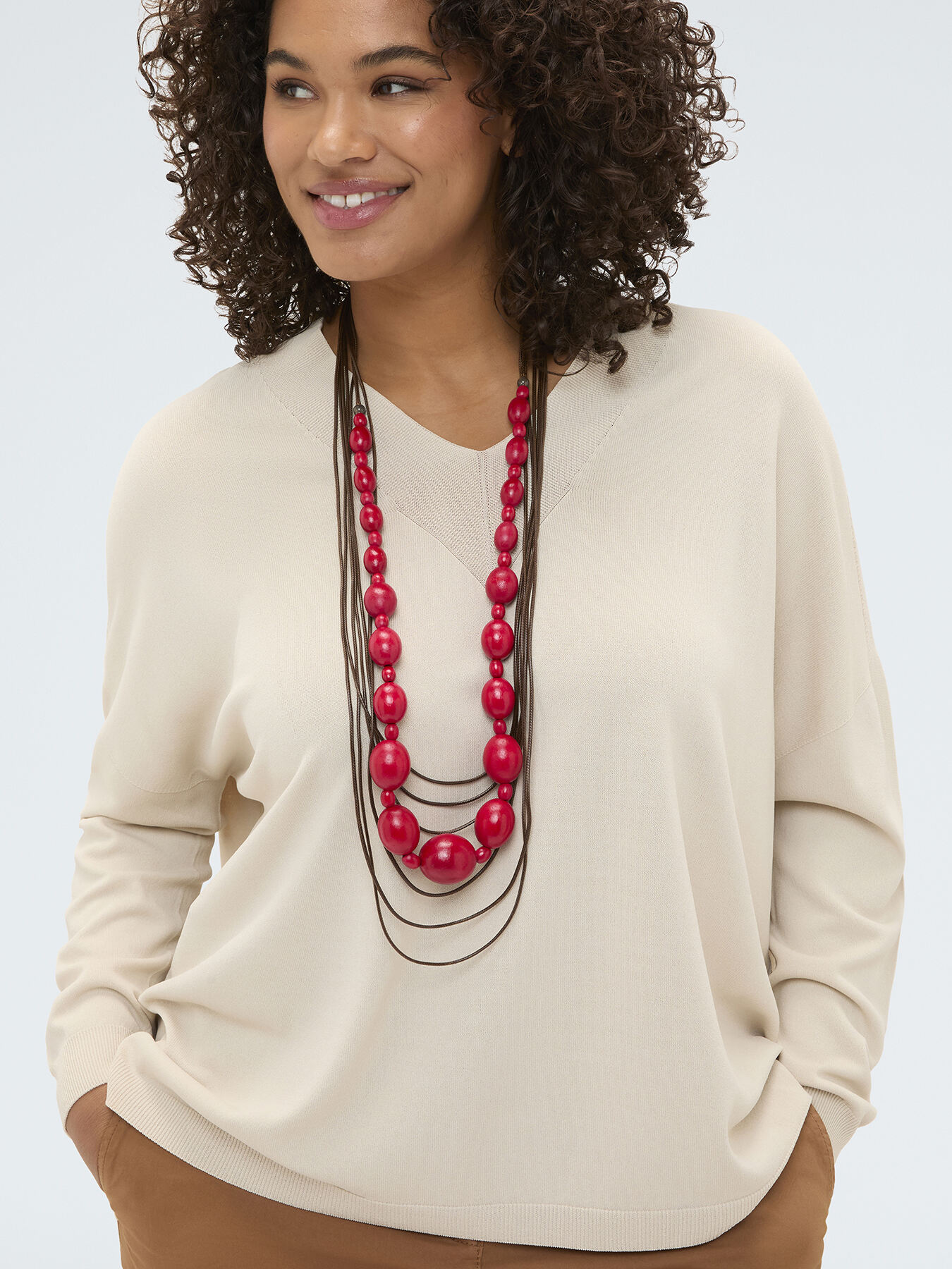 Necklace with red beads and cords image number 0