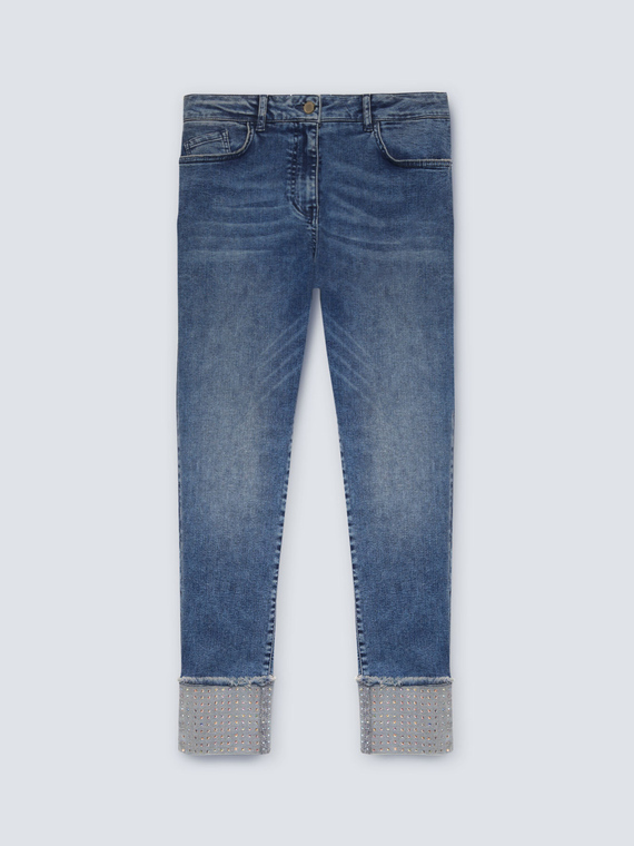 Jeans skinny con risvolto e strass