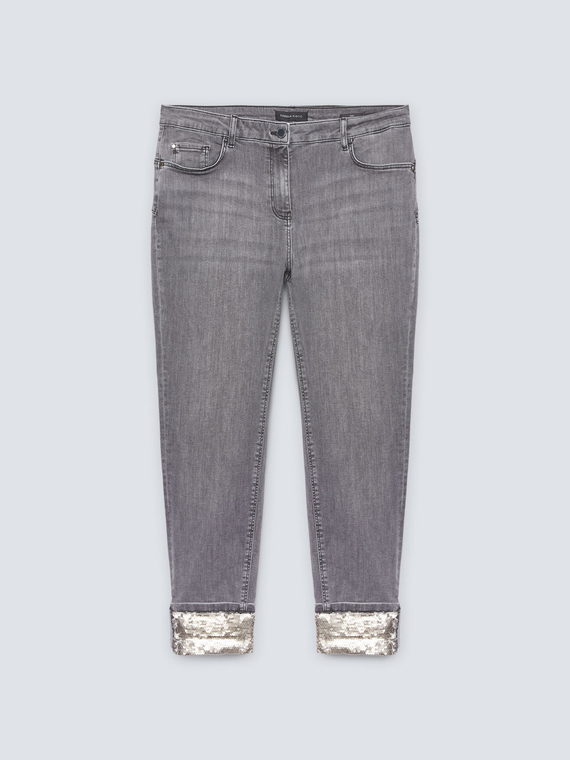 Jeans delgados con dobladillo de lentejuelas