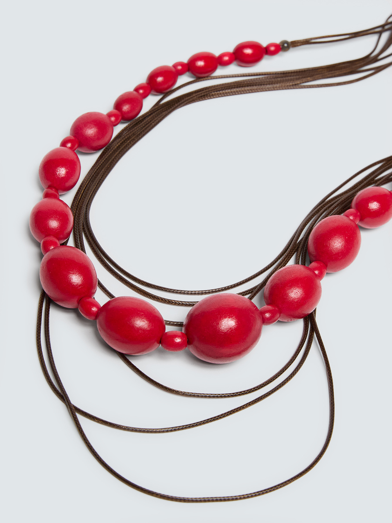 Necklace with red beads and cords image number 2