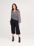 Pantaloni cropped in maglia image number 1
