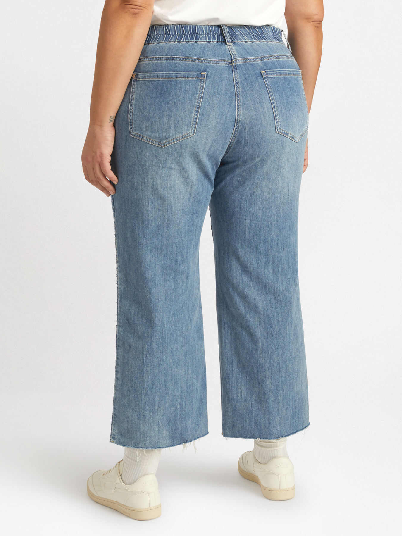 Cropped jeans with trims decorated with micro-tears and sequins image number 1