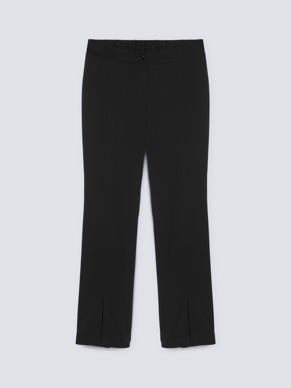 Trousers with slits at the hem