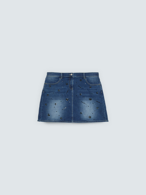 Denim mini skirt with appliqu&eacute;s